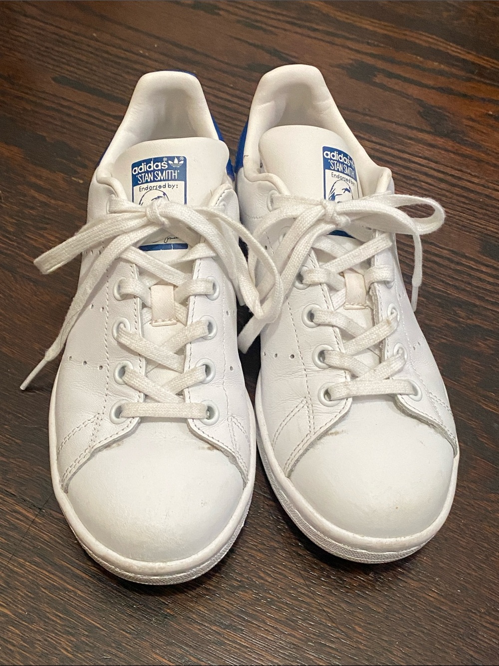 adidas white sneakers with blue heel tab and perforated sides